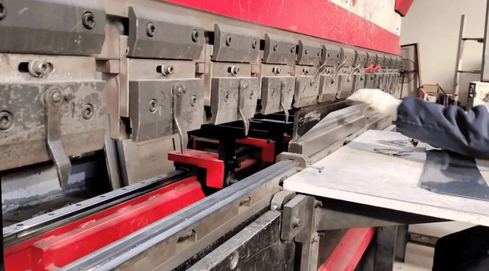 Sheet metal components after bending — formed body panels ready for welding