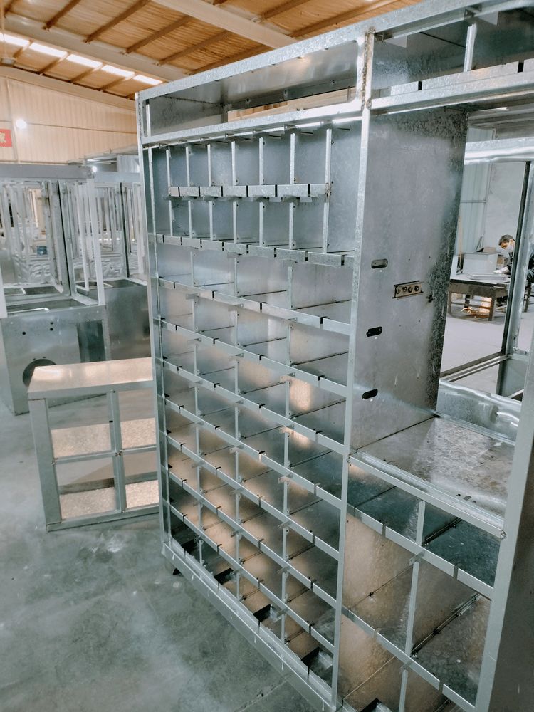 Close-up of welding in progress on a vending machine frame structure