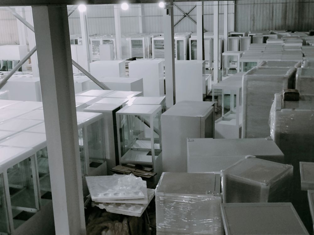 Warehouse storage area — completed and crated vending machines staged for dispatch